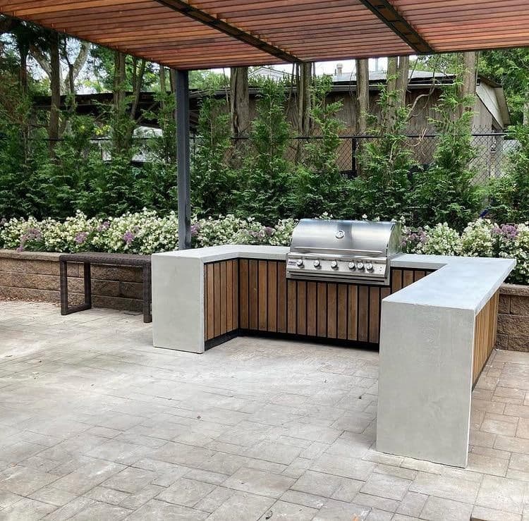 Concrete Counter top with horizontal slats and wooden pergola