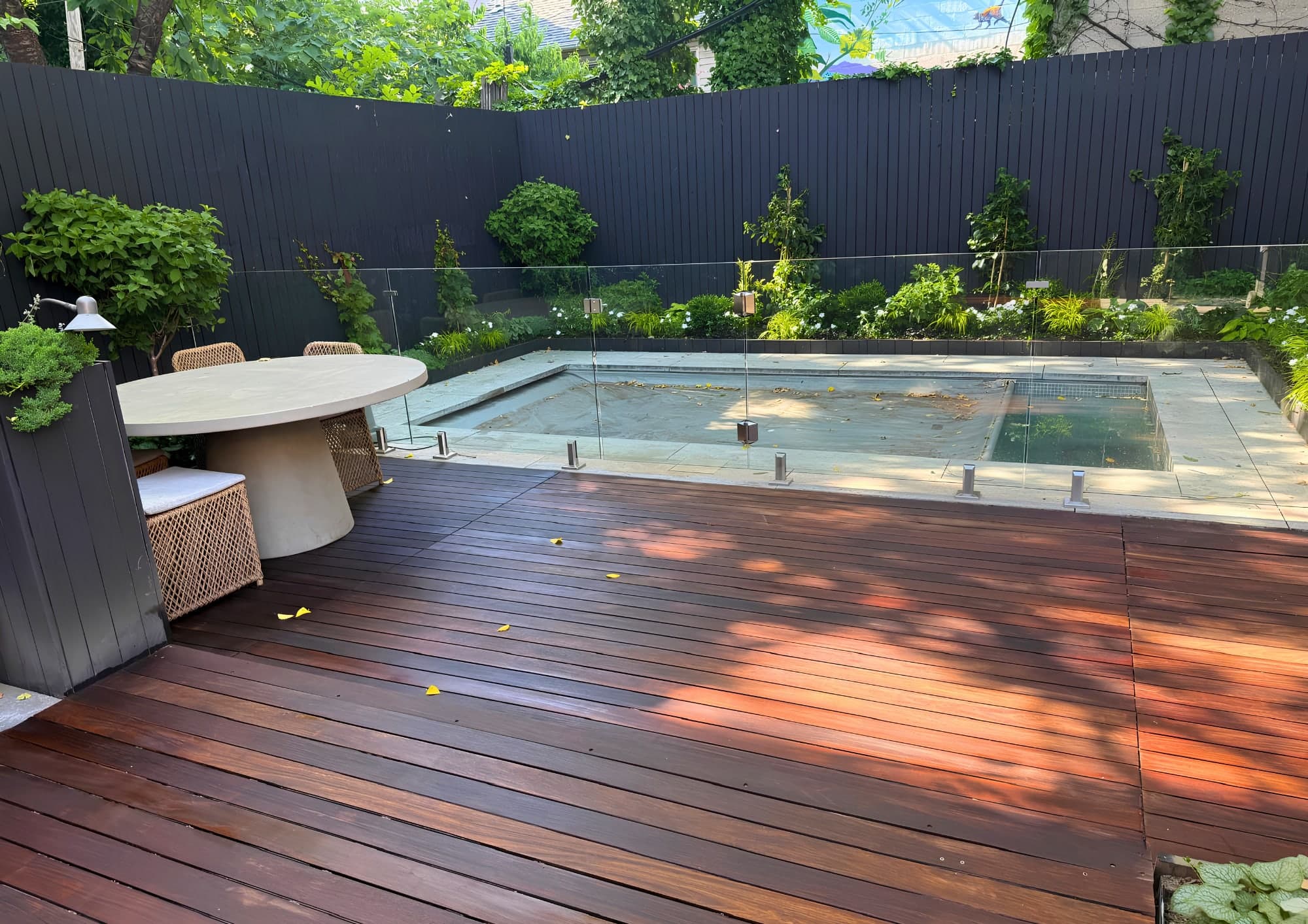 Ipe pool deck stained with privacy fencing